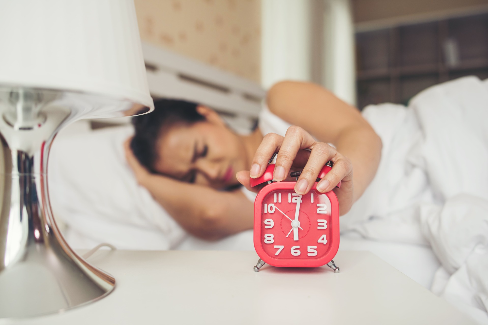 Girl Snoozing Alarm Due To Laziness