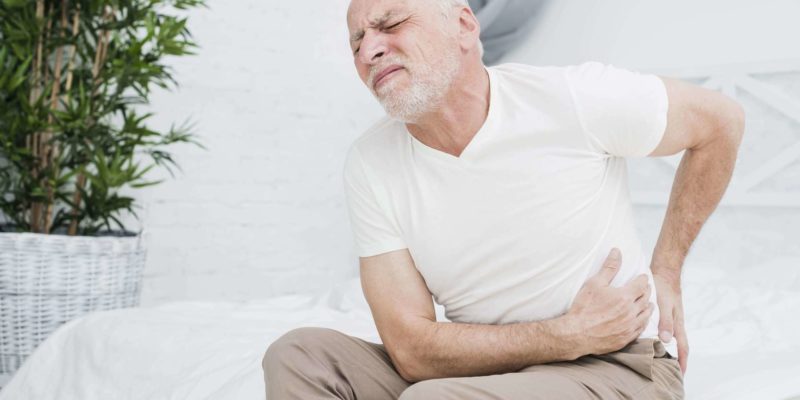 Old man Suffering From Back Pain
